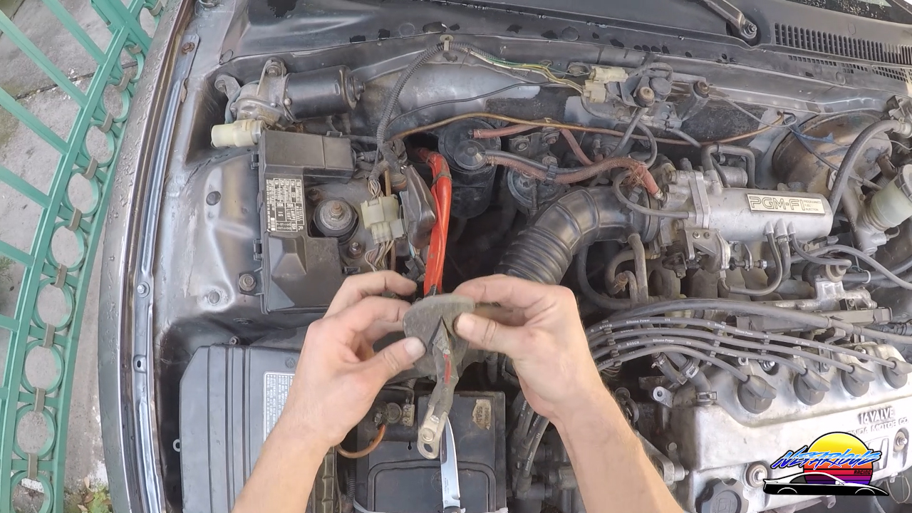 Cutting a slit in the grommet for the car battery cable